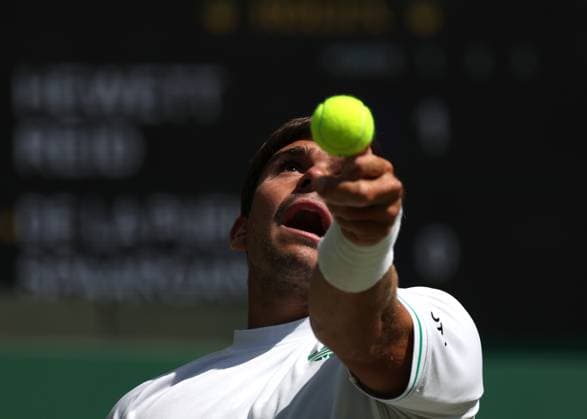 12th July 2025; All England Lawn Tennis and Croquet Club, London, England; Wimbledon Tennis Tournament, Day 13; Martin De La Puente (ESP) serves to Gordon Reid (GBR) in their men s wheelchair doubles final  ActionPlus12812508 JohnxPatrickxFletcher