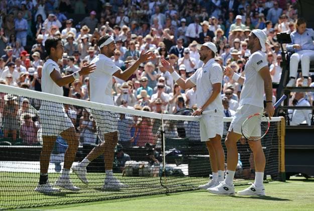 (250712) -- LONDON, July 12, 2025 -- Julian Cash (1st R) Lloyd Glasspool (2nd R) greet Rinky Hijikata (1st L) David Pel after the men s doubles final between Rinky Hijikata (Australia) David Pel (the Netherlands) and Julian Cash Lloyd Glasspool of Britain at the Wimbledon Tennis Championships in London, Britain, July 12, 2025. ) (SP)BRITAIN-LONDON-TENNIS-WIMBLEDON-MEN S DOUBLES-FINAL ZhaoxDingzhe 