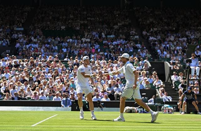 (250712) -- LONDON, July 12, 2025 -- Julian Cash (L) Lloyd Glasspool react during the men s doubles final between Rinky Hijikata (Australia) David Pel (the Netherlands) and Julian Cash Lloyd Glasspool of Britain at the Wimbledon Tennis Championships in London, Britain, July 12, 2025. ) (SP)BRITAIN-LONDON-TENNIS-WIMBLEDON-MEN S DOUBLES-FINAL ZhaoxDingzhe 