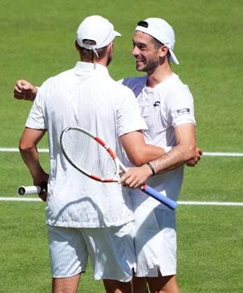 Tennis - 2025 Wimbledon Championships - Mens Doubles Final - Winky Hijikata and David Pel v Julian Cash and Lloyd Glasspool All England Lawn Tennis & Croquet Club - Saturday 12th July 2025 Julian Cash and Lloyd Glasspool celebrate winning match point 
