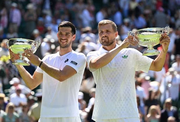 (250712) -- LONDON, July 12, 2025 -- Julian Cash (L) Lloyd Glasspool pose with their trophies during the awarding ceremony after the men s doubles final between Rinky Hijikata (Australia) David Pel (the Netherlands) and Julian Cash Lloyd Glasspool of Britain at the Wimbledon Tennis Championships in London, Britain, July 12, 2025. ) (SP)BRITAIN-LONDON-TENNIS-WIMBLEDON-MEN S DOUBLES-FINAL ZhaoxDingzhe 