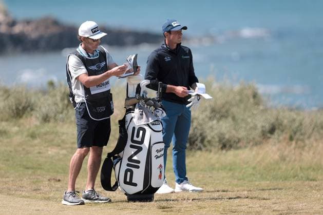 UK: The Genesis Scottish Open at The Renaissance Club, North Berwick, Scotland on 12 July 2025: Pictured: Victor Hovland (Norway) and his caddie Shay Knight on the 13th fairway during the third round of the Genesis Scottish Open 2025 at The Renaissance Club, North Berwick, Scotland North Berwick The Renaissance Club Scotland Copyright: xAlexxToddx