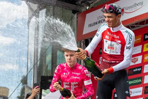 CYCLING - Tour of Austria 2025 FELDKIRCH,AUSTRIA,13.JUL.25 - CYCLING - Tour of Austria, stage 5, Feldkirch - Feldkirch. Image shows the top two of the tour 2025: Archie Ryan (IRL EF Education - Easypost) and Isaac Del Torro Romero (MEX UAE Team Emirates XRG). Keywords: champaign shower.  GEPAxpictures xOliverxLerch