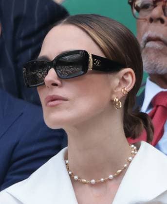 British actress Keira Knightley watches the tennis in the Royal Box before the Wimbledon Men s Singles match on day fourteen of the 2025 Wimbledon Championships in London on Sunday, July 13, 2025.  LON2025071308 HUGOxPHILPOTT
