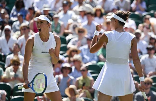 (250713) -- LONDON, July 13, 2025 -- Veronika Kudermetova Elise Mertens (L) celebrate during the women s doubles final between Hsieh Su-Wei (Chinese Taipei) Jelena Ostapenko (Latvia) and Veronika Kudermetova (Russia) Elise Mertens (Belgium) at the Wimbledon Tennis Championships in London, Britain, July 13, 2025. ) (SP)BRITAIN-LONDON-TENNIS-WIMBLEDON-WOMEN S DOUBLES-FINAL LixYing 
