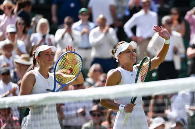 (250713) -- LONDON, July 13, 2025 -- Veronika Kudermetova Elise Mertens (L) celebrate victory after the women s doubles final between Hsieh Su-Wei (Chinese Taipei) Jelena Ostapenko (Latvia) and Veronika Kudermetova (Russia) Elise Mertens (Belgium) at the Wimbledon Tennis Championships in London, Britain, July 13, 2025. ) (SP)BRITAIN-LONDON-TENNIS-WIMBLEDON-WOMEN S DOUBLES-FINAL LixYing 