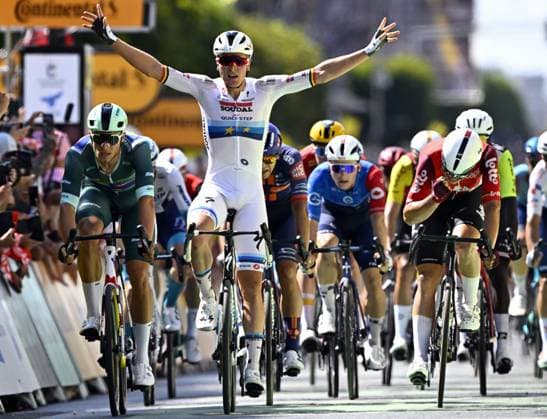 Belgian Tim Merlier of Soudal Quick-Step celebrates as he crosses the finish line to win stage nine of the 2025 Tour de France cycling, from Chinon to Chateauroux (170 km), on Sunday 13 July 2025 in France. The 112th edition of the Tour de France starts on Saturday 5 July in Lille, France, and will finish in Paris, France on the 27th of July. JASPERxJACOBS  x129082528x