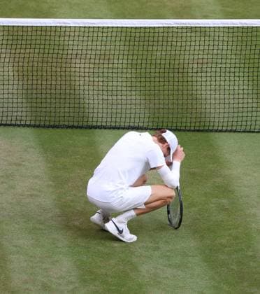Italian Jannik Sinner celebrates victory in the Men s Wimbledon singles after defeating Spain s Carlos Alcaraz on day fourteen of the 2025 Wimbledon Championships in London on Sunday, July 13, 2025. Sinner won 4-6,6-4,6-4,6-4.  LON2025071388 HUGOxPHILPOTT