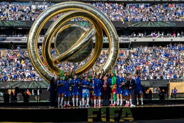Chelsea FC v Paris Saint-Germain FC - FIFA Club World Cup Reece James of Chelsea FC lifts the trophy next to Donald Trump as his teammates celebrate during the FIFA Club World Cup final football match between Chelsea FC and Paris Saint-Germain FC. East Rutherford United States Copyright: xNicoloxCampox