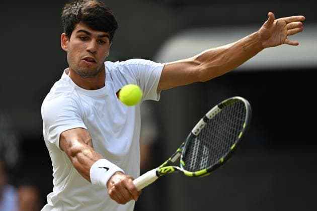 (250714) -- LONDON, July 14, 2025 -- Carlos Alcaraz hits a return during the men s singles final between Carlos Alcaraz of Spain and Jannik Sinner of Italy at the Wimbledon Tennis Championships in London, Britain, July 13, 2025. ) (SP)BRITAIN-LONDON-TENNIS-WIMBLEDON-MEN S SINGLES-FINAL LixYing 