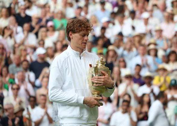 13th July 2025; All England Lawn Tennis and Croquet Club, London, England; Wimbledon Tennis Tournament, Day 14; Jannik Sinner (ITA) holds the Gentlemen& x2019;s Singles Trophy after defeating Alacaraz by 3 sets to 1  ActionPlus12813504 JohnxPatrickxFletcher