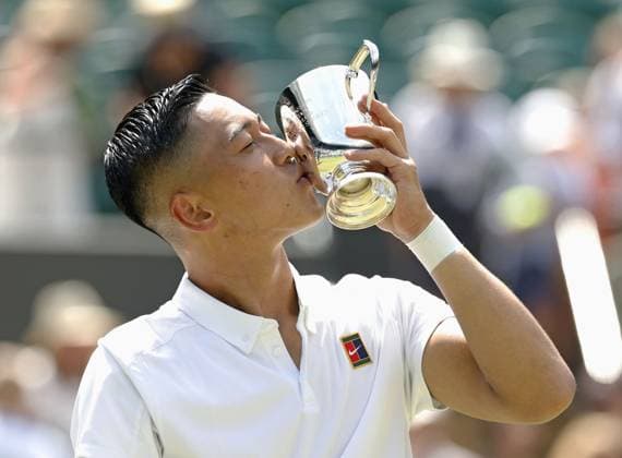 Tennis: Wimbledon championships Tokito Oda of Japan kisses the victor s trophy after beating Alfie Hewett of Britain in the men s wheelchair singles final at the Wimbledon tennis tournament in London on July 13, 2025.  A14AA0004721914P