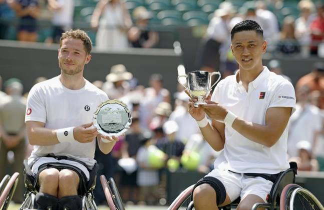 Tennis: Wimbledon championships Tokito Oda (R) of Japan poses with the victor s trophy after beating Alfie Hewett (L) of Britain in the men s wheelchair singles final at the Wimbledon tennis tournament in London on July 13, 2025.  A14AA0004721917P