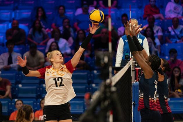 (250714) -- ARLINGTON, July 14, 2025 -- Hanna Orthmann (L) of Germany tips the ball during the pool 8 match between Germany and Dominican Republic at the Women s Volleyball Nations League (VNL) 2025 in Arlington, the United States, July 13, 2025. (Photo by Xinhua) (SP)U.S.-ARLINGTON-VOLLEYBALL-NATIONS LEAGUE-WOMEN ChenxChen 