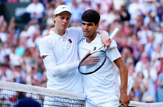 Jannik Sinner and Carlos Alcaraz hug at the net after Sinner won the final in four sets Wimbledon Tennis Championships, Day 14, The All England Lawn Tennis and Croquet Club, London, UK - 13 Jul 2025London The All England Lawn Tennis and United Kingdom  Copyright: xJavierxGarcia Shutterstockx 15392297km