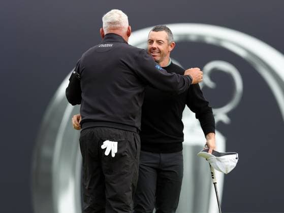 15th July 2025; Royal Portrush Golf Club, Portrush, County Antrim, Northern Ireland; The Open Golf Championship Practice Day 3; Rory McIlroy (NIR) hugs playing partner Darren Clarke (NIR) on the 18th green  ActionPlus12814086 DavidxBlunsden