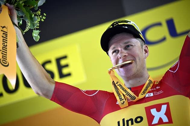 Norwegian Jonas Abrahamsen of Uno-X Mobility celebrates on the podium after winning stage 11 of the 2025 Tour de France cycling, from and to Toulouse (154km), on Wednesday 16 July 2025 in France. The 112th edition of the Tour de France starts on Saturday 5 July in Lille, France, and will finish in Paris, France on the 27th of July. JASPERxJACOBS  x129381619x
