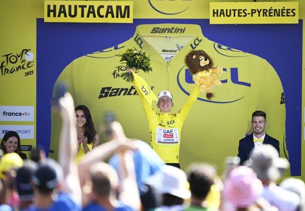 Slovenian Tadej Pogacar of UAE Team Emirates celebrates on the podium in the yellow jersey of leader in the overall ranking after stage 12 of the 2025 Tour de France cycling, from Auch to Hautacam (181 km), on Thursday 17 July 2025 in France. The 112th edition of the Tour de France starts on Saturday 5 July in Lille, France, and will finish in Paris, France on the 27th of July. JASPERxJACOBS  x129449777x