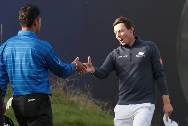 England s Matt Fitzpatrick shakes Hideki Matsuyama s hand on the eighteenth green at the end of the Second round at the 153rd Open Championship at Royal Portrush Golf Club in Portrush, Northern Ireland on Friday, July 18, 2025. Fitzpatrick is joint leader with American Scottie Scheffler on nine under par.  LON20250718122 HUGOxPHILPOTT