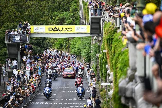 The peloton pictured underneath the Pau banner at the start of stage 14 of the 2025 Tour de France cycling race, from Pau to Luchon-Superbagneres (183 km), on Saturday 19 July 2025 in France. The 112th edition of the Tour de France starts on Saturday 5 July in Lille, France, and will finish in Paris, France on the 27th of July. JASPERxJACOBS  x129556224x