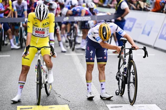Slovenian Tadej Pogacar of UAE Team Emirates and Belgian Remco Evenepoel of Soudal Quick-Step pictured at the start of stage 14 of the 2025 Tour de France cycling race, from Pau to Luchon-Superbagneres (183 km), on Saturday 19 July 2025 in France. The 112th edition of the Tour de France starts on Saturday 5 July in Lille, France, and will finish in Paris, France on the 27th of July. DIRKxWAEM  x129556838x