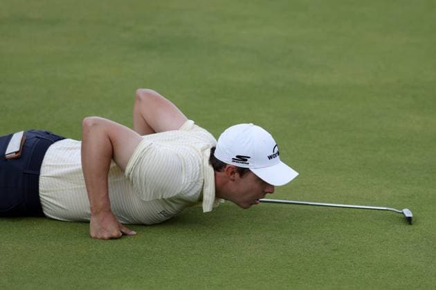 19th July 2025; Royal Portrush Golf Club, Portrush, County Antrim, Northern Ireland; The Open Golf Championship Round 3; Matthew Fitzpatrick (ENG) lies prone to look at the line of his putt at the 18th green  ActionPlus12815306 DavidxBlunsden