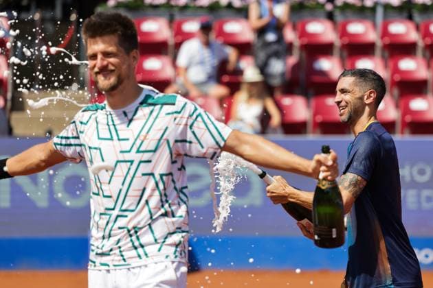 Sander Arends, Netherlands, (left) and Guido Andreozzi, Argentina, (right) celebrate the win of the men s doubles final on Sunday where they faced Adam Pavlasek, Czech Republic, and Jan Zielinski, Poland, during the Nordea Open tennis tournament in Bastad, Sweden on the 20th of July 2025. BASTAD SWEDEN x9200x