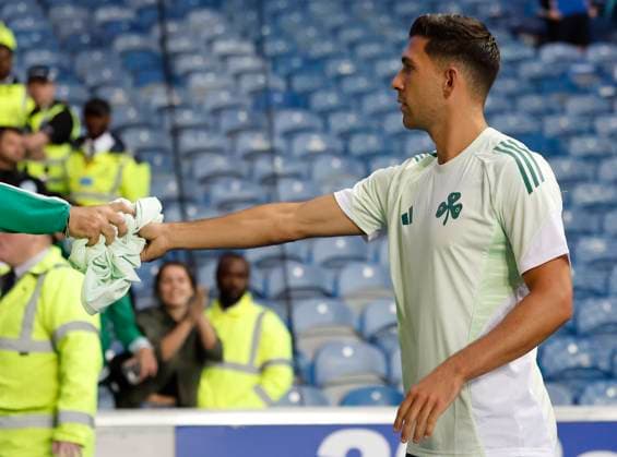 Rangers v Panathinaikos F.C. UEFA Champions League Tasos Bakasetas of Panathinaikos F.C. (right) gives his match shirt to a supporter during the UEFA Champions League Second Qualifying Round First Leg match at Ibrox Stadium, Glasgow UK Newspapers OUT Copyright: xFredxPalmerx FIL-21991-0060