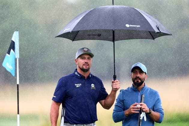 Bryson DeChambeau of USA and Golf Saudi CEO Noah Alireza during their round. LIV Golf UK, Pro-AM, Golf, JCB Golf & Country Club, Uttoxeter, UK - 24 Jul 2025Uttoxeter JCB Golf & Country Club United Kingdom EDITORIAL USE ONLY No use with unauthorised audio, video, data, fixture lists, club league logos or live services. Online in-match use limited to 120 images, no video emulation. No use in betting, games or single club league player publications. Copyright: xJamesxMarsh Shutterstockx 15410870ar