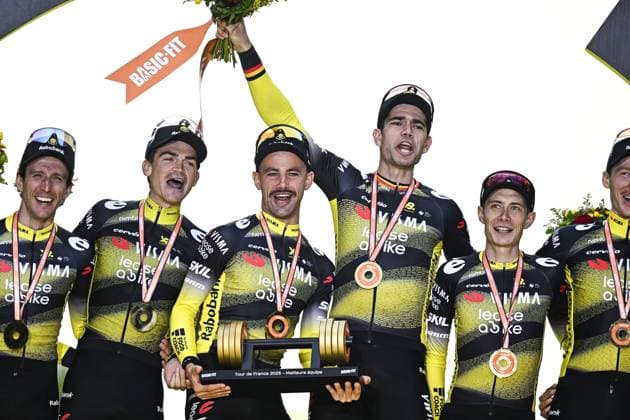Belgian Victor Campenaerts of Team Visma-Lease a Bike, Belgian Wout van Aert of Team Visma-Lease a Bike and Danish Jonas Vingegaard Hansen of Team Visma-Lease a Bike celebrating the award for best team at stage 21 of the 2025 Tour de France cycling race, from Mantes-la-Ville to Paris (120km), on Sunday 27 July 2025 in France. The 112th edition of the Tour de France starts on Saturday 5 July in Lille, France, and will finish in Paris, France on the 27th of July. JASPERxJACOBS  x130134970x