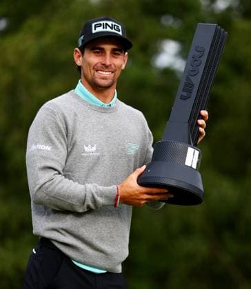 Joaquin Niemann of Chile celebrates winning the tournament with the trophy. LIV Golf UK, Day Three, Golf, JCB Golf & Country Club, Uttoxeter, UK - 27 Jul 2025Uttoxeter JCB Golf & Country Club United Kingdom EDITORIAL USE ONLY No use with unauthorised audio, video, data, fixture lists, club league logos or live services. Online in-match use limited to 120 images, no video emulation. No use in betting, games or single club league player publications. Copyright: xJamesxMarsh Shutterstockx 15410873cm