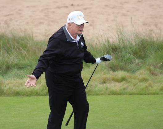American President Donald Trump reacts after hitting the first ball at The New Course at Trump International Links, Aberdeen in Scotland on Tuesday, July 29, 2025. Trump is on a four day visit to Scotland where he will be playing golf and meeting International leaders for trade discussions.  LON2025072907 HUGOxPHILPOTT