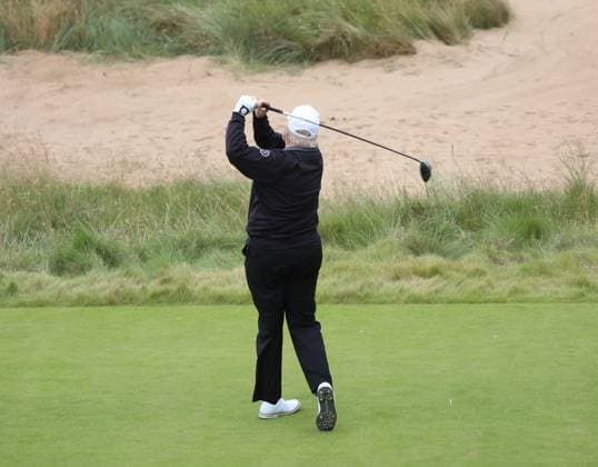 American President Donald Trump hits the first ball at The New Course at Trump International Links, Aberdeen in Scotland on Tuesday, July 29, 2025. Trump is on a four day visit to Scotland where he will be playing golf and meeting International leaders for trade discussions.  LON2025072906 HUGOxPHILPOTT