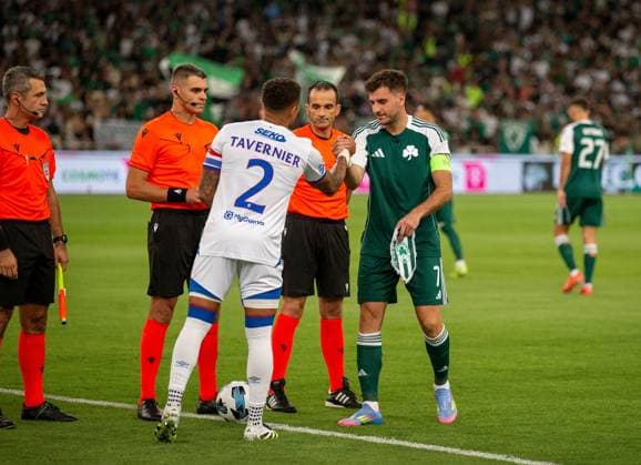 30th July 2025; Spiros Louis Olympic Stadium, Athens, Greece; UEFA Champions League Second Qualifying Round Second Leg Football, Panathinaikos versus Rangers; James Tavernier of Rangers and Fotis Ioannidis of Panathinaikos shake hands as they exchange pennants before the match  VagelisxGeorgariou