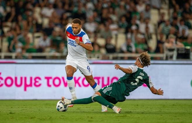 30th July 2025; Spiros Louis Olympic Stadium, Athens, Greece; UEFA Champions League Second Qualifying Round Second Leg Football, Panathinaikos versus Rangers; Ahmed Touba of Panathinaikos slide tackles Cyriel Dessers of Rangers  VagelisxGeorgariou