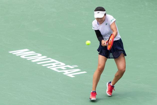 July 31, 2025, Montreal, Quebec, Canada: LIN ZHU from China back hand in second set against Susan Lamens from Netherland in round of 32 at Canadian Open at IGA stadium in Montreal, Quebec, Canada on 2025-07-31 Montreal Canada - ZUMAl189 20250731_zsp_l189_035 Copyright: xYannickxLegarex