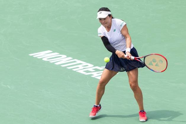 July 31, 2025, Montreal, Quebec, Canada: LIN ZHU from China back hand in second set against Susan Lamens from Netherland in round of 32 at Canadian Open at IGA stadium in Montreal, Quebec, Canada on 2025-07-31 Montreal Canada - ZUMAl189 20250731_zsp_l189_037 Copyright: xYannickxLegarex