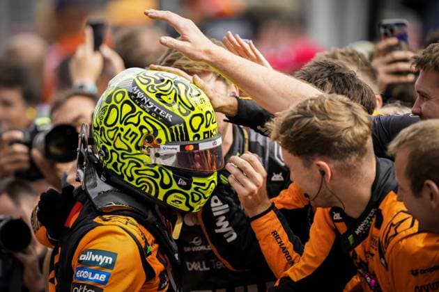 BOEDAPEST - Lando Norris (McLaren) receives congratulations after winning at the Hungaroring during the Hungarian Grand Prix. ANP SANDER KING xVIxANPxSportx xxANPxIVx 532754421 originalFilename: 532754421.jpg
