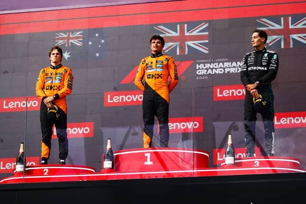 F1 Hungarian Grand Prix Lando Norris of McLaren, Oscar Piastri of McLaren and George Russell of Mercedes are seen on the podium after the Formula 1 Hungarian Grand Prix at the Hungaroring circuit in Mogyorod near Budapest on August 3rd, 2025. Budapest Hungary  Copyright: xBeataxZawrzelx originalFilename:zawrzel-f1hungar250803_npyCm.jpg