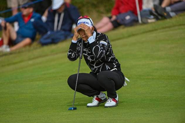 3rd August 2025; Royal Porthcawl Golf Club, Porthcawl, Wales; AIG Womens Open Golf, Final Round; A Lim Kim reads the green on 13  AledxHopkins