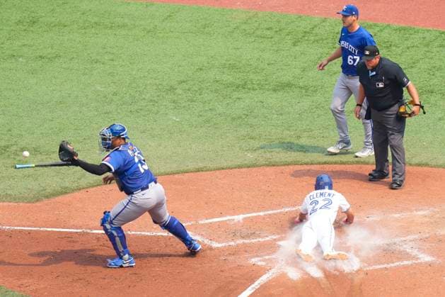 August 3, 2025, Toronto, On, CANADA: Toronto Blue Jays Ernie Clement (22) scores in front of Kansas City Royals catcher Salvador Perez (13) after a RBI single from Joey Loperfido (10) during fifth inning MLB, Baseball Herren, USA baseball action in Toronto on Sunday August 3, 2025. Canada News - August 3, 2025  - ZUMAc35_ 20250803_zaf_c35_048 Copyright: xChrisxYoungx