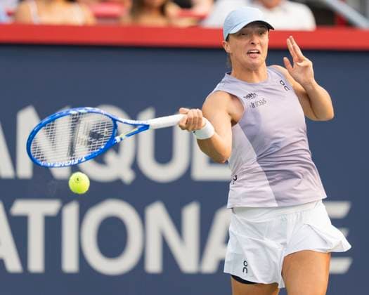 August 3, 2025, Montreal, Pq, Canada: Iga Swiatek of Poland hits a return to Clara Tauson of Denmark during round of 16 tennis action at the National Bank Open in Montreal, Sunday, Aug. 3, 2025. Canada News - August 3, 2025  - ZUMAc35_ 20250803_zaf_c35_164 Copyright: xChristinnexMuschix