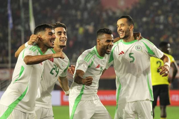 (250805) -- KAMPALA, Aug. 5, 2025 -- Players of Algeria celebrate after scoring during the group C match between Uganda and Algeria at the African Nations Championship (CHAN) 2024 at Mandela National Stadium in Kampala, capital of Uganda, on Aug. 4, 2025. (Photo by Xinhua) (SP)UGANDA-KAMPALA-CHAN 2024-GROUP C-UGANDA VS ALGERIA HajarahxNalwadda 