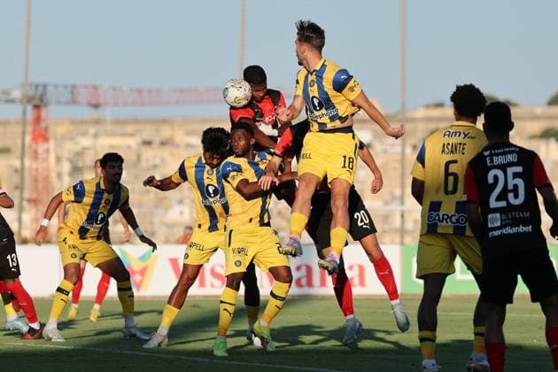 N Dri Philippe Koffi (top centre) of Hamrun Spartans heads the ball during the the UEFA Europa League Third qualifying round, 1st leg soccer match between Hamrun Spartans FC and Maccabi Tel Aviv FC at the Tony Bezzina Stadium, in Paola, Malta, on 05 August 2025. UEFA Europa League - Hamrun Spartans FC v Maccabi Tel Aviv FC