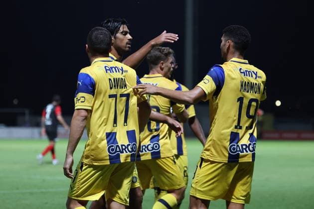 Elad Madmon (right) of Tel Aviv is congratulated by team mated after scoring the 1-2 goal during the the UEFA Europa League Third qualifying round, 1st leg soccer match between Hamrun Spartans FC and Maccabi Tel Aviv FC at the Tony Bezzina Stadium, in Paola, Malta, on 05 August 2025. UEFA Europa League - Hamrun Spartans FC v Maccabi Tel Aviv FC