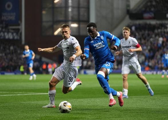 Djeidi Gassama of Rangers challenges for the ball with Amar Memic of Viktoria Plzen. Rangers v Viktoria Plzen, UEFA Champions League, 3rd Qualifying Round, First Leg, Football, Ibrox Stadium, Glasgow, Scotland, UK - 05 Aug 2025Glasgow Ibrox Stadium Scotland United Kingdom EDITORIAL USE ONLY No use with unauthorised audio, video, data, fixture lists, club league logos or live services. Online in-match use limited to 120 images, no video emulation. No use in betting, games or single club league player publications. Copyright: xStuartxWallace Shutterstockx 15428174cc