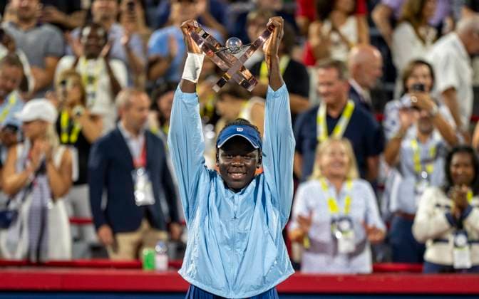 August 7, 2025, Montreal, Pq, Canada: Victoria Mboko of Canada hoists the trophy following her win over Naomi Osaka of Japan during finals tennis action at the National Bank Open in Montreal, Thursday, Aug. 7, 2025. Canada News - August 7, 2025  - ZUMAc35_ 20250807_zaf_c35_163 Copyright: xChristinnexMuschix