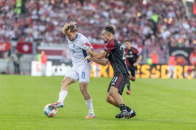 Nürnberg, Deutschland 08. August 2025: 2. Liga - 2025 2026 - 1. FC Nürnberg vs. SV Darmstadt 98 Im Bild: v. li. im Zweikampf Luca Marseiler (Darmstadt) und Luka Lochoshvili (FCN) DFL regulations prohibit any use of photographs as image sequences and or quasi-video
