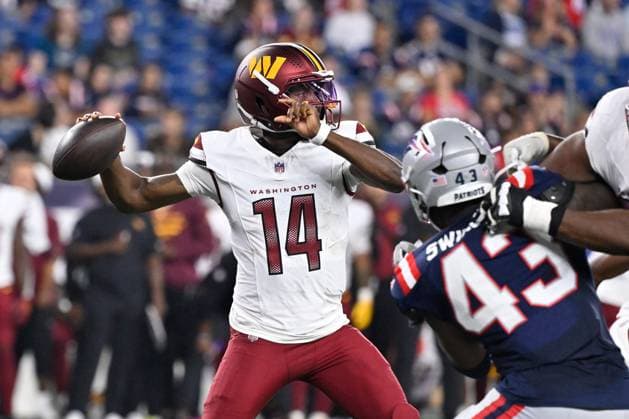 Aug 8, 2025; Foxborough, MA, USA; Washington Commanders quarterback Josh Johnson (14) throws a pass under pressure during the second half against the New England Patriots at Gillette Stadium. CSM Foxborough USA - ZUMAc04_ 20250808_faf_c04_033 Copyright: xEricxCanhax