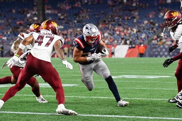 Aug 8, 2025; Foxborough, MA, USA; New England Patriots running back Lan Larison (34) runs the ball against Washington Commanders safety Robert McDaniel (47) for a touchdown during the second half at Gillette Stadium. CSM Foxborough USA - ZUMAc04_ 20250808_faf_c04_044 Copyright: xEricxCanhax